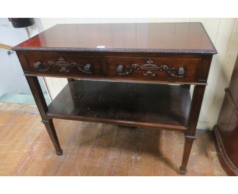 A GEORGIAN REVIVAL MAHOGANY FRAMED SIDE TABLE, the rectangular top with foliate carved rim above two frieze drawers, decorate