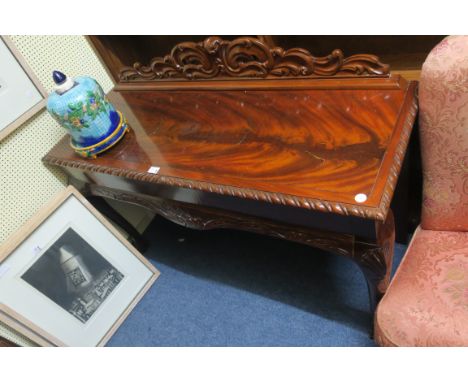 A CHIPPENDALE STYLE MAHOGANY SIDE TABLE, the rectangular top with gadrooned rim, on cabriole legs,82cms x 132cms x 30cms.