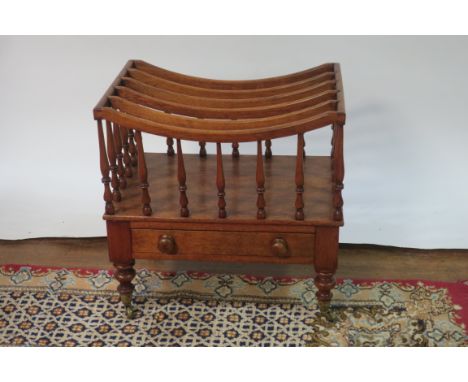 A VICTORIAN STYLE MAHOGANY CANTERBURY, the openwork compartmented top between spindle turned supports with a single drawer on