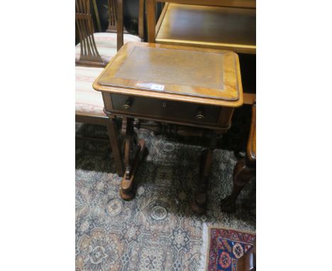 A LATE 19th CENTURY MAHOGANY VENEERED TABLE, the rectangular leather tooled top with moulded rim above a single frieze drawer