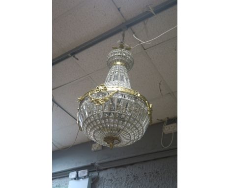 A CONTINENTAL STYLE GILT BRASS AND BEADED GLASS CENTRE LIGHT, the openwork frame filled with cut glass pendants, the brass fr