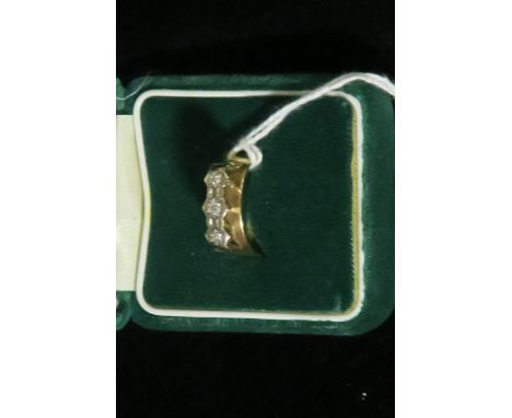 A 9ct GOLD DIAMOND THREE STONE DRESS RING.