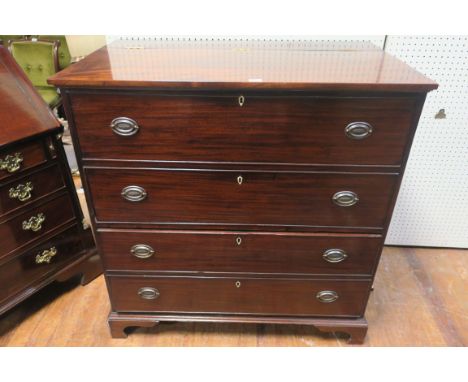 A GEORGIAN STYLE MAHOGANY CHEST, the rectangular hinged top lifting to reveal a deep cupboard, the front with two faux and tw