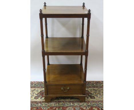 19TH CENTURY MAHOGANY WHAT-NOT the rectangular open shelves between turned supports the single drawer on shaped bracket feet 
