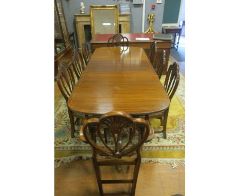 A VERY FINE HEPPLEWHITE STYLE MAHOGANY NINE PIECE DINING SUITE, comprising eight Prince of Wales back chairs, including a pai