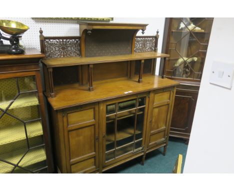 AN EDWARDIAN MAHOGANY SIDE CABINET,  the super structure with open shelves above a glazed door and cupboards on moulded legs 