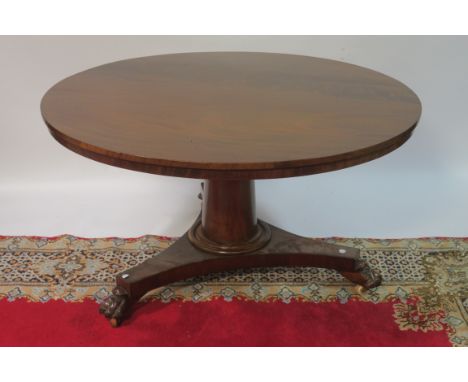 A 19TH CENTURY CIRCULAR DINING ROOM TABLE, the plain top with recessed fieze raised on a tapering pod with tripod platform ba