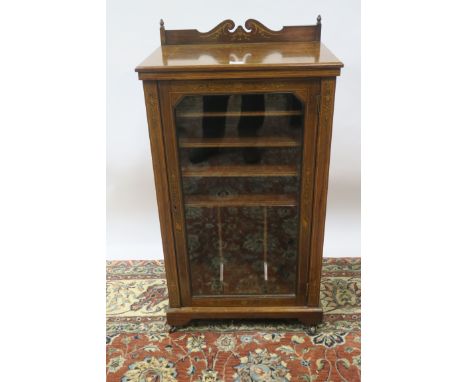 A VICTORIAN ROSEWOOD AND MARQUETRY INLAID FOLIO CABINET, the rectangular top with raised back decorated with classical urns a