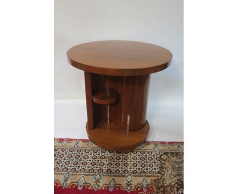 A 20TH CENTURY MAHOGANY ART DECO STYLE OCCASIONAL TABLE, the plain top above the S shaped support with open shelves on circul