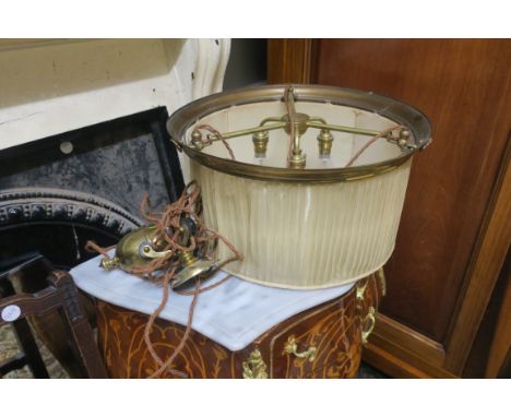 A BRASS RISE AND FALL LIGHT FITTING