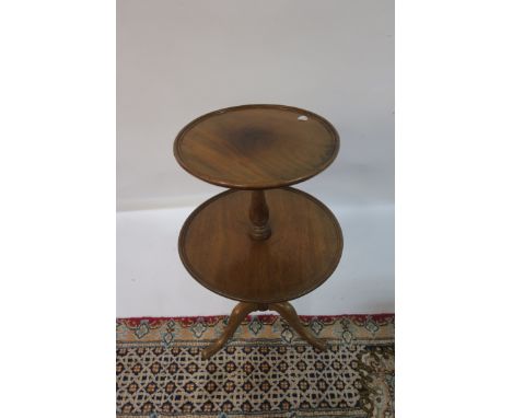 A GEORGIAN STYLE MAHOGANY TWO TIER DUMBWAITER,  on tripod support 77cms high  