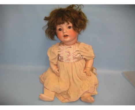 Simon Halbig bisque headed doll having sleeping eyes, open mouth with two teeth and articulated body, 20ins high