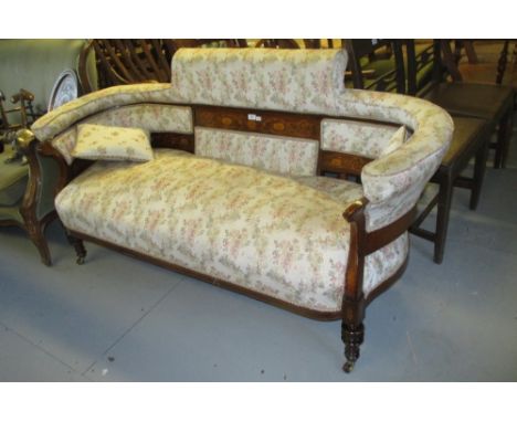 Edwardian rosewood and boxwood marquetry inlaid floral upholstered sofa, raised on turned fluted supports with brass and cera