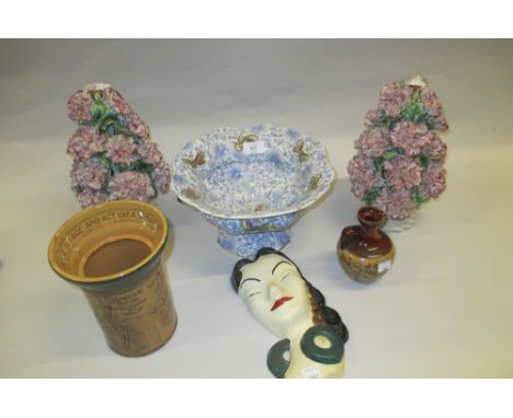 Two Continental pottery floral encrusted lamp bases, a Royal Doulton transfer printed pedestal bowl decorated with butterflie