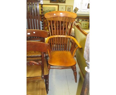 19th Century beech and elm comb back Windsor chair with panel seat and turned supports with stretchers