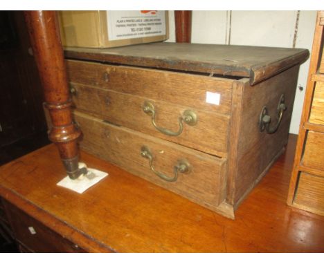 19th Century oak carpenters tool box, the hinged lid above two drawers with brass swan neck handles (a/f)