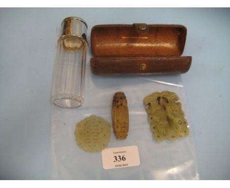 Small leather cased travelling flask with integral cup, the case marked Swain & Adney, together with three Chinese green ston