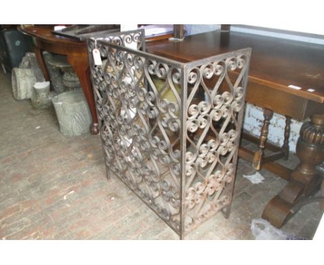 Black painted wrought iron scroll work fireguard