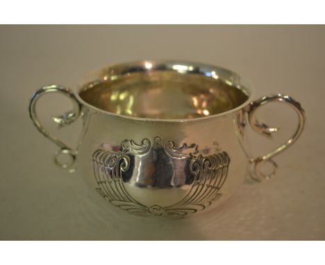 London silver late Art Nouveau two handled porringer with handbeaten engraved bowl and C-scroll handles in the form of serpen