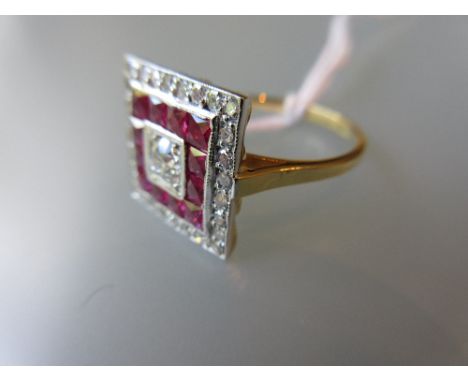 Art Deco style ruby and diamond ring, the central diamond with a surround of concentric square bands of square cut rubies and