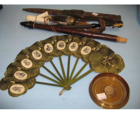 World War II bayonet in metal sheath with leather attachment, floral paper fan decorated with black and white embossed portra