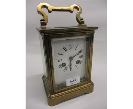 Late 19th or early 20th Century French gilt brass Goliath carriage clock, the enamel dial (a/f) with Roman numerals, the two 