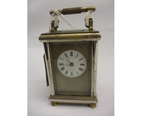 Early 20th Century brass and silvered brass cased carriage clock with circular enamel dial, Roman numerals, signed C. Marcks 