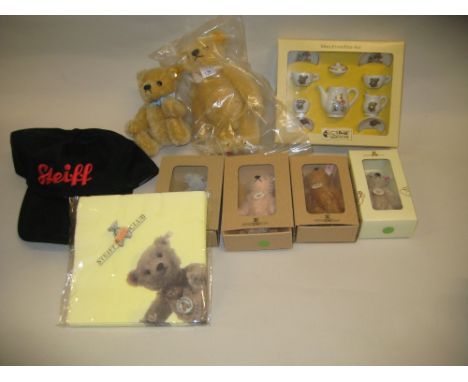 Two small modern Steiff bears unboxed, four miniature Steiff bears in original boxes, a Steiff cap, miniature porcelain tease
