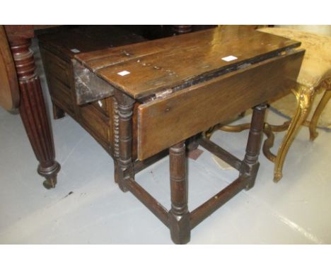 Antique oak joint stool base having later drop-leaf top
