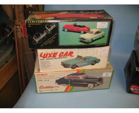 Two boxed Luxe cars, 1950 Cadillac and another boxed model, convertible Sedan