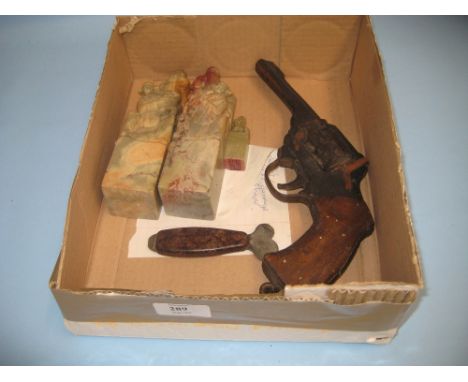 Wooden handmade model gun (reputedly Trench Art) and an Air Corps Bakelite handled opener together with a pair of carved soap