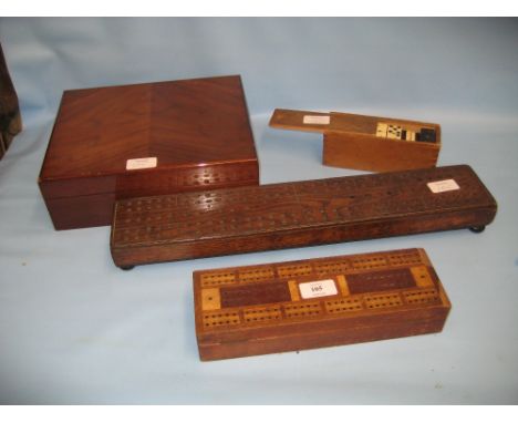 Boxed set of bone and ebony dominoes, two cribbage boards and a walnut humidor box