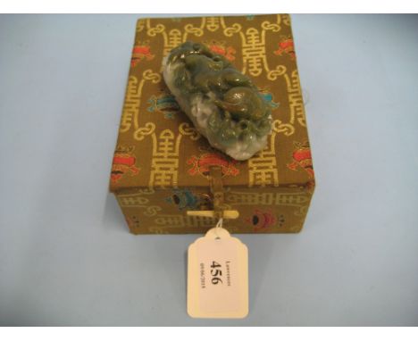 Chinese carved green variegated jade scroll weight, decorated in deep relief with various animals and foliage, 3ins long in a