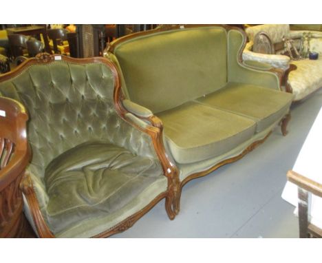 French carved walnut and upholstered two seat sofa on cabriole front supports together with a similar armchair