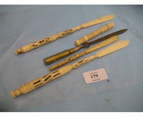 Three late 19th Century carved ivory letter openers with Stanhope viewer inserts together with a Trench Art letter opener and