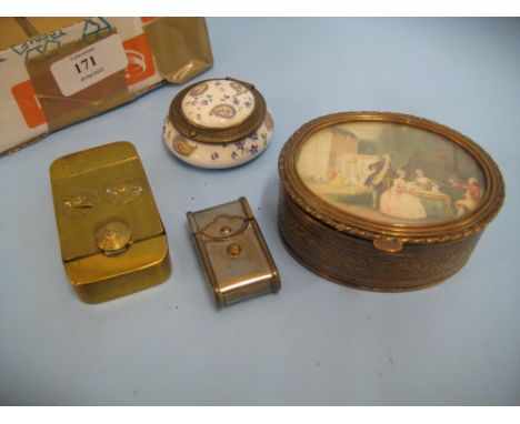 Small brass combination snuff box, circular floral decorated porcelain box with hinged cover, silver plated match striker and
