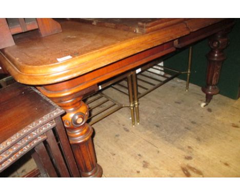 Victorian mahogany rectangular extending dining table, the moulded top with a shallow frieze raised on turned fluted supports