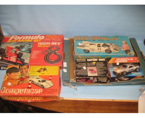 Computacar by Mettoy in original box, a Formula 500 slot racing set in original box and three boxed radio control cars, box c