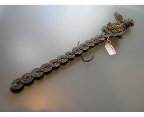 Curio currency, a model sword with suspended medallion, constructed from antique Chinese coins