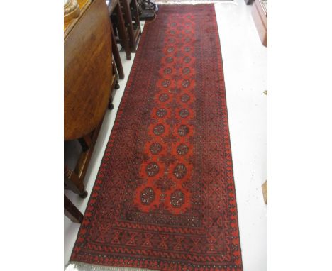 Modern red ground Afghan runner, 2.86m x 0.78m