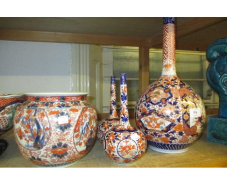 Large late 19th Century Imari bottle vase together with a pair of similar smaller vases and a jardiniere (a/f)