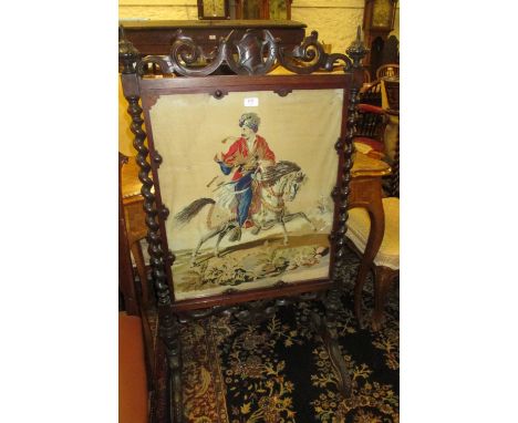 Victorian rosewood firescreen inset with a needlepoint panel depicting a Turkish figure on horseback, the moulded frame with 
