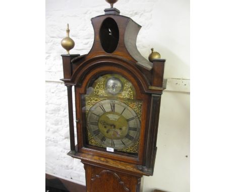 George III oak longcase clock, the broken arch hood with shaped surmount, ball finials and flanking pilasters above an arched