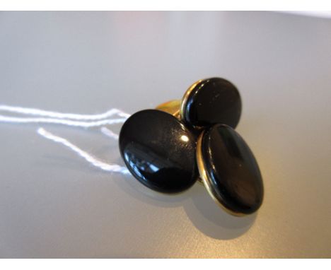 Pair of yellow metal and black onyx cufflinks