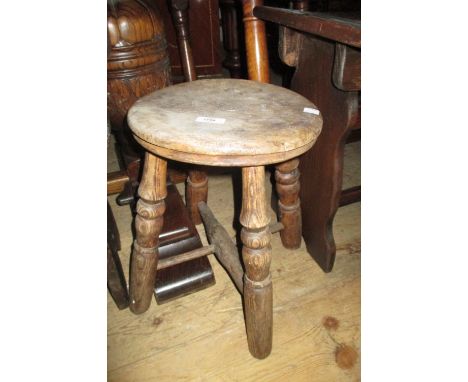 19th Century stained pine milking stool together with two other wooden stools