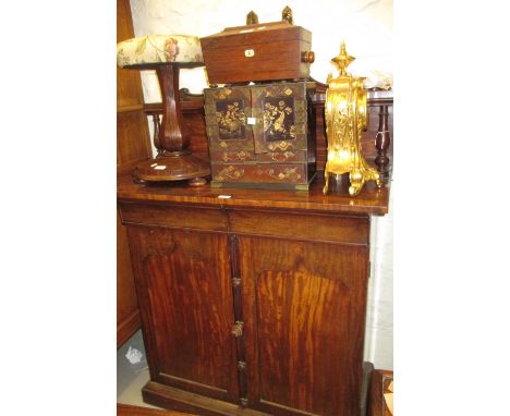 Mid 19th Century mahogany chiffonier with a low shelf back with carved crested surmount, above two shaped drawers with two pa