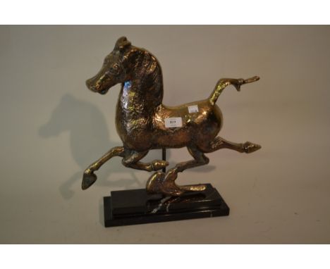 Silver over resin model of the flying horse of Kansu, hallmarked London 1974, maker B.J.S. on a rectangular veined stepped ma