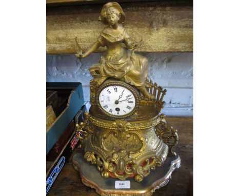 19th Century French gilt metal mantel clock having circular enamel dial with Roman numerals and single train movement surmoun