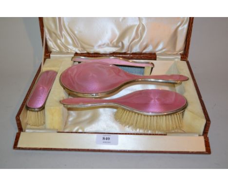 Four piece silver mounted and pink enamel dressing table set in original fitted box