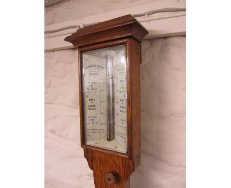 Victorian oak stick barometer, the ivory scale with single adjustable vernier, signed Murray and Heath, London